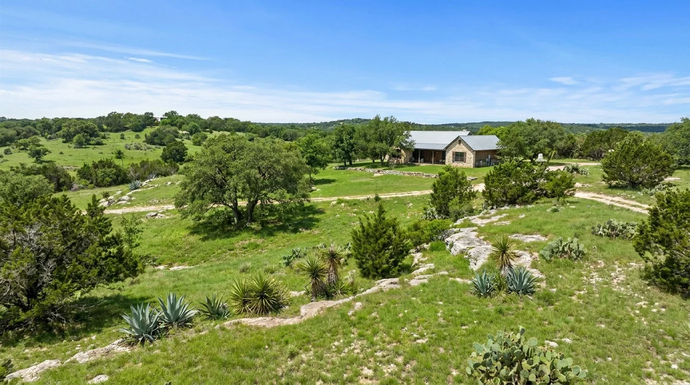 A stone ranch house in the green Hill Country west of Austin